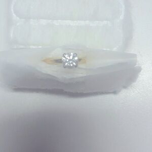 A round brilliant diamond weighing .84 carats